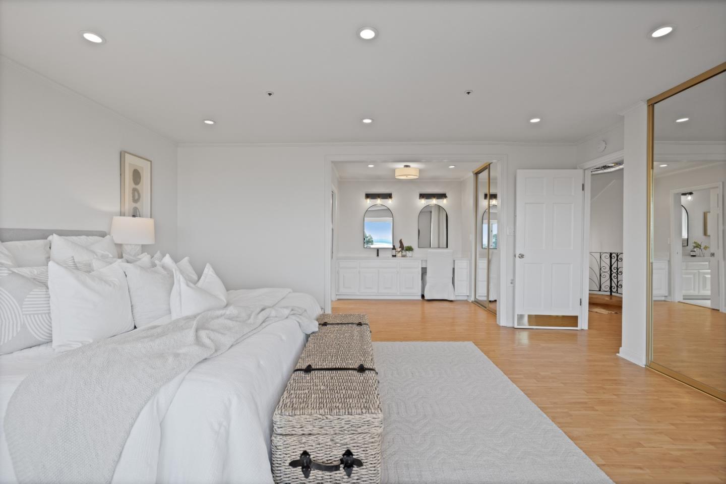 866 Morningside Drive Millbrae, CA 94030 - Photo 27 of 57 a spacious bedroom with a bed and a large mirror