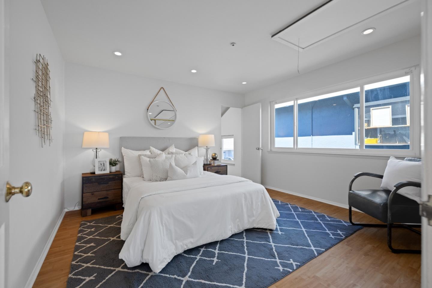 866 Morningside Drive Millbrae, CA 94030 - Photo 33 of 57 a bedroom with a bed and chair