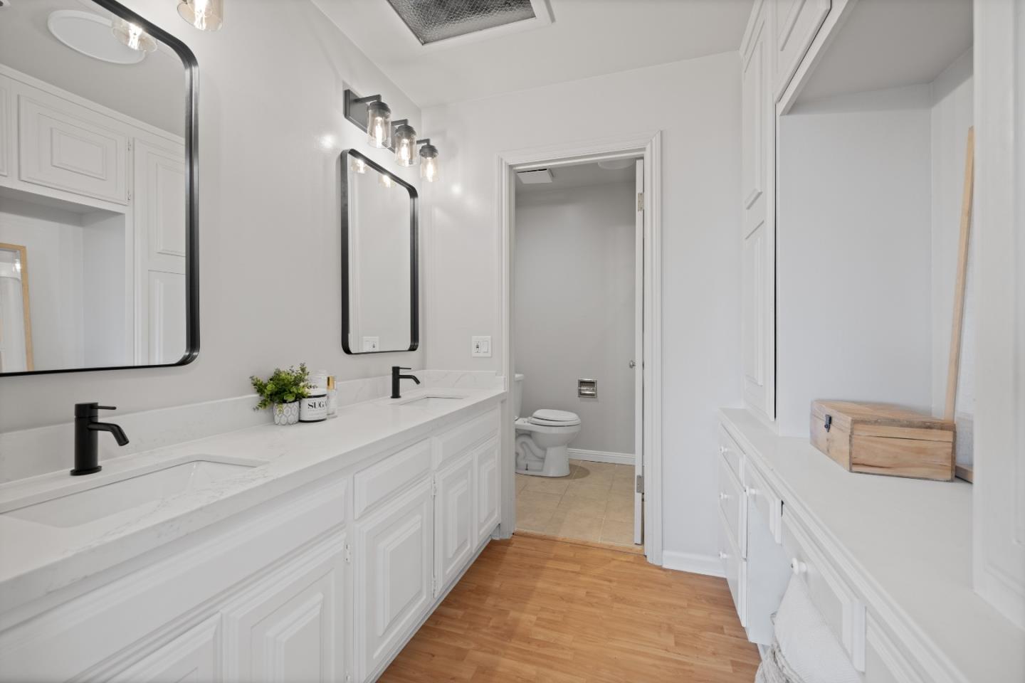 866 Morningside Drive Millbrae, CA 94030 - Photo 35 of 57 a en suite bathroom with a double vanity sink a mirror and a bathtub