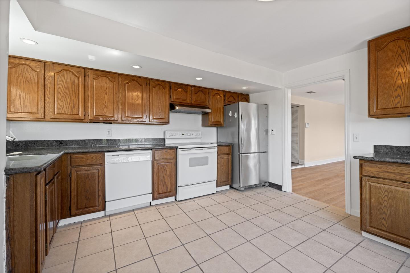 866 Morningside Drive Millbrae, CA 94030 - Photo 50 of 57 a kitchen with a sink a counter top space and stainless steel appliances
