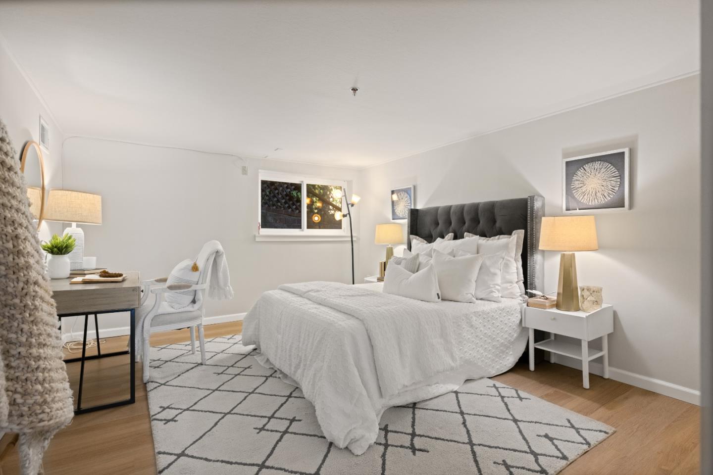 866 Morningside Drive Millbrae, CA 94030 - Photo 54 of 57 a bedroom with a bed a rug and painting on the wall