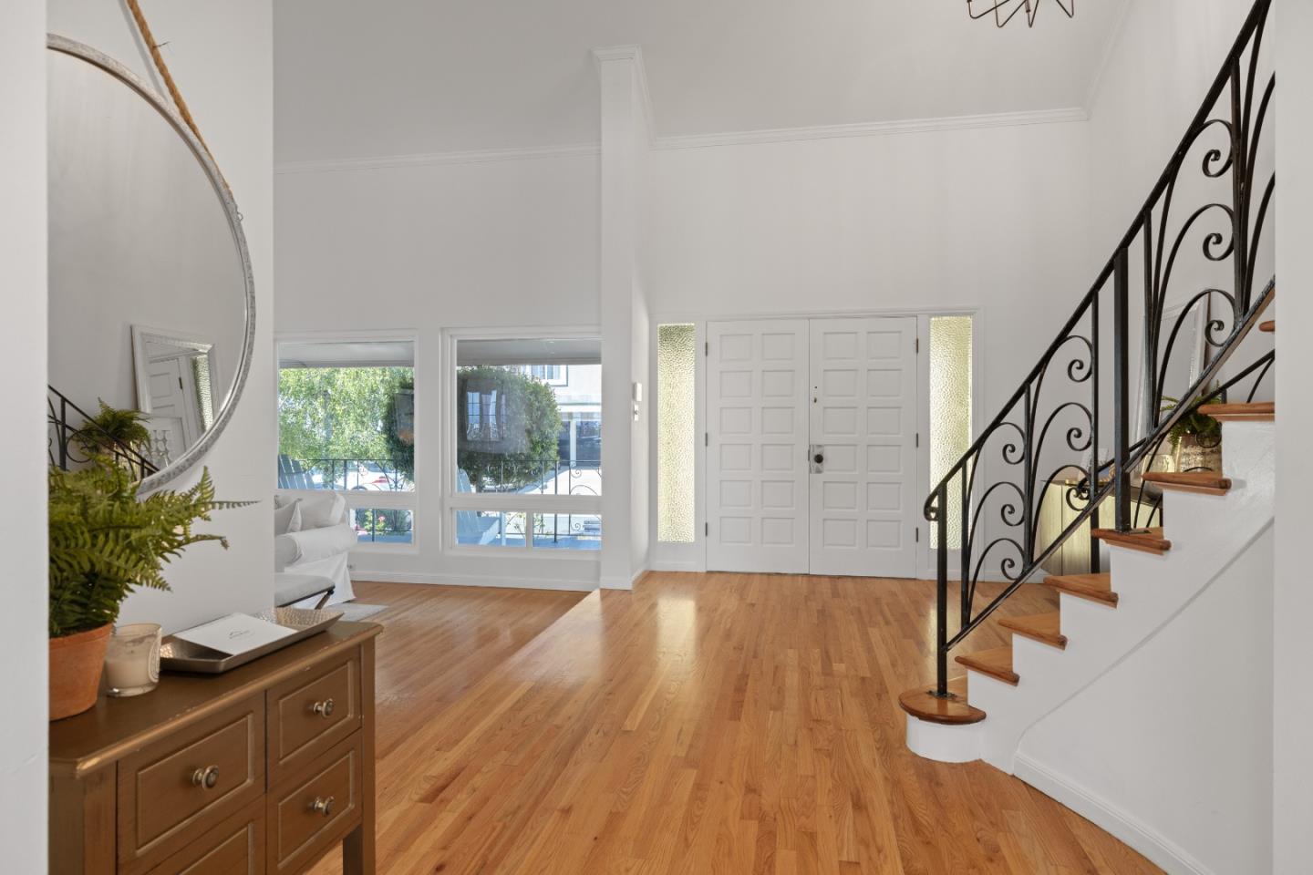 866 Morningside Drive Millbrae, CA 94030 - Photo 7 of 57 a view of an entryway with wooden floor and windows