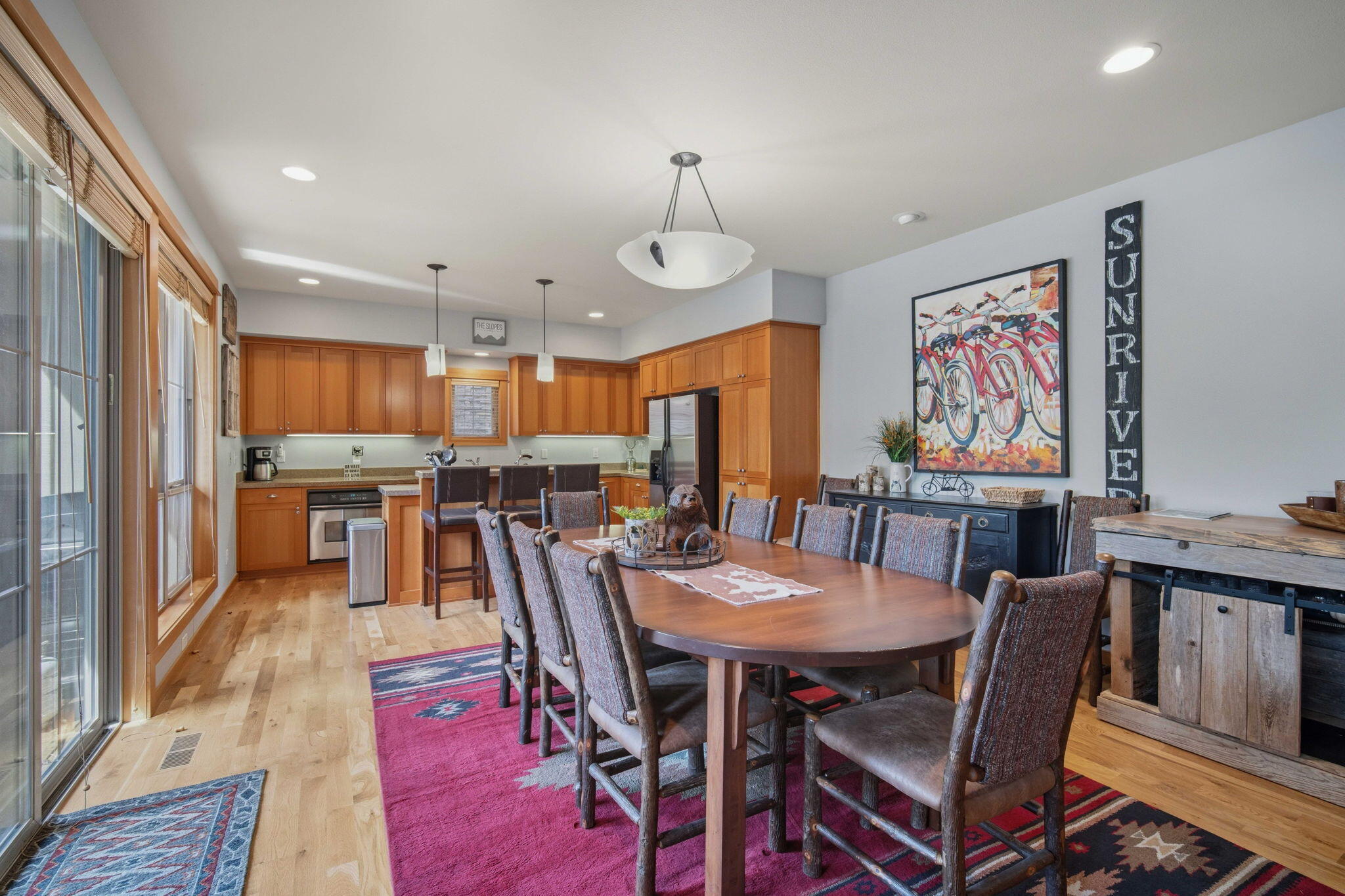 57129 Evergreen Loop, Unit 44 Sunriver, OR 97707 - Photo 15 of 59 a view of a dining room with furniture window and wooden floor