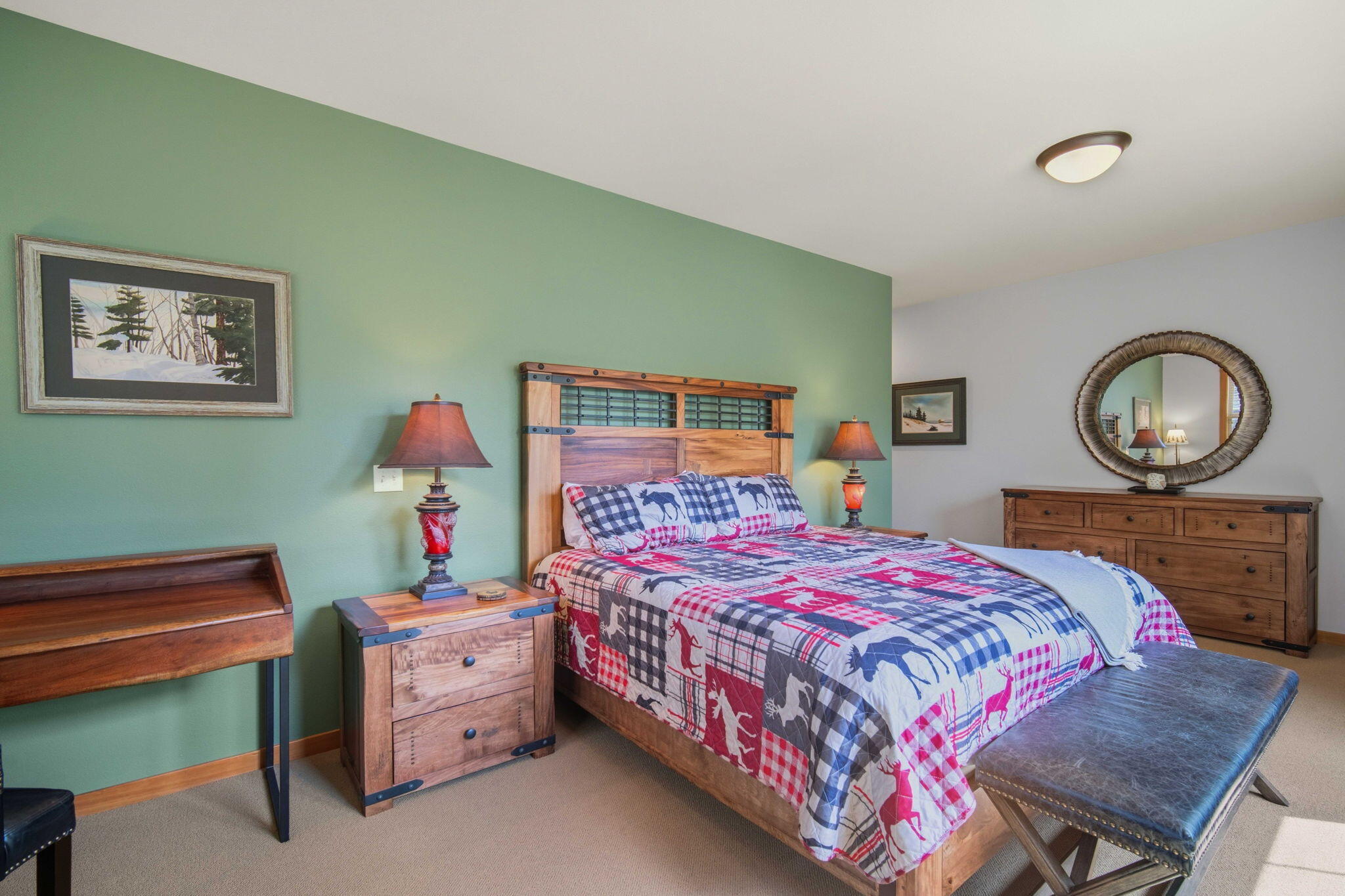57129 Evergreen Loop, Unit 44 Sunriver, OR 97707 - Photo 28 of 59 a bedroom with a bed and a dresser in it