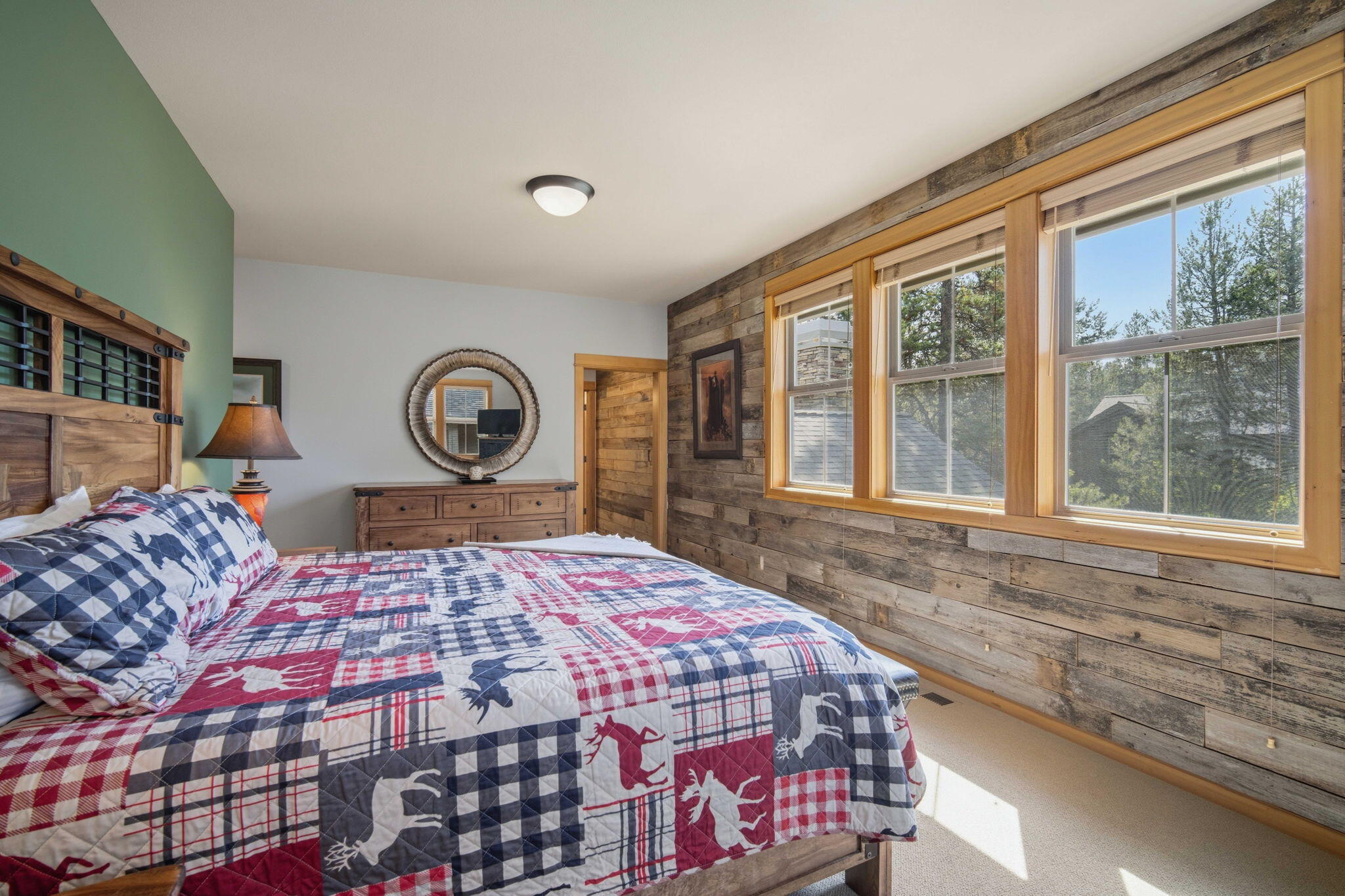 57129 Evergreen Loop, Unit 44 Sunriver, OR 97707 - Photo 29 of 59 a bedroom with a large bed and a large window