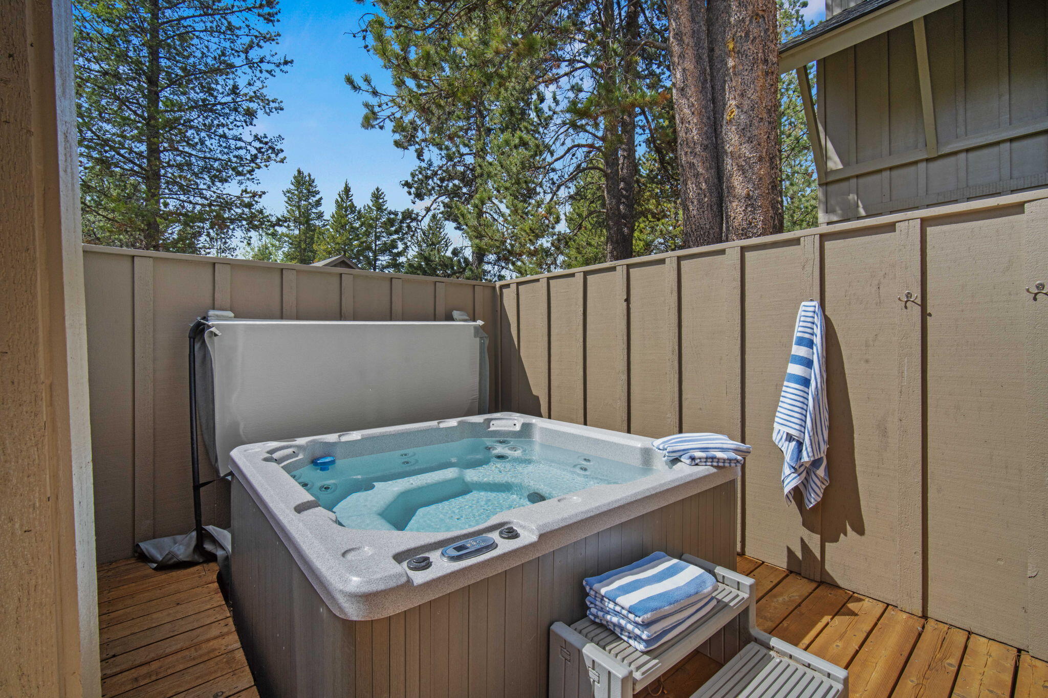 57129 Evergreen Loop, Unit 44 Sunriver, OR 97707 - Photo 42 of 59 a view of a backyard with furniture and wooden floor