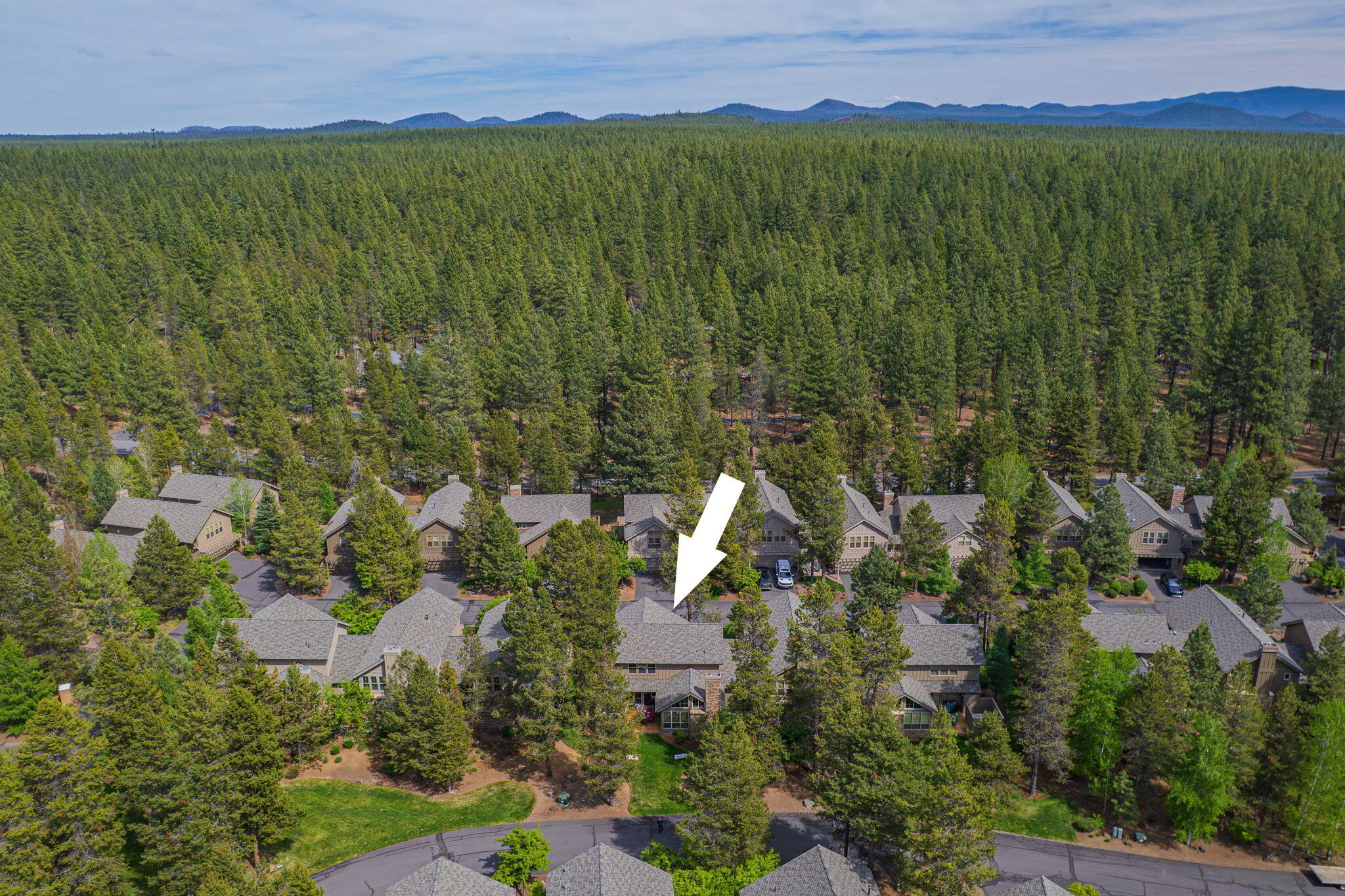 57129 Evergreen Loop, Unit 44 Sunriver, OR 97707 - Photo 48 of 59 an aerial view of a house with a yard