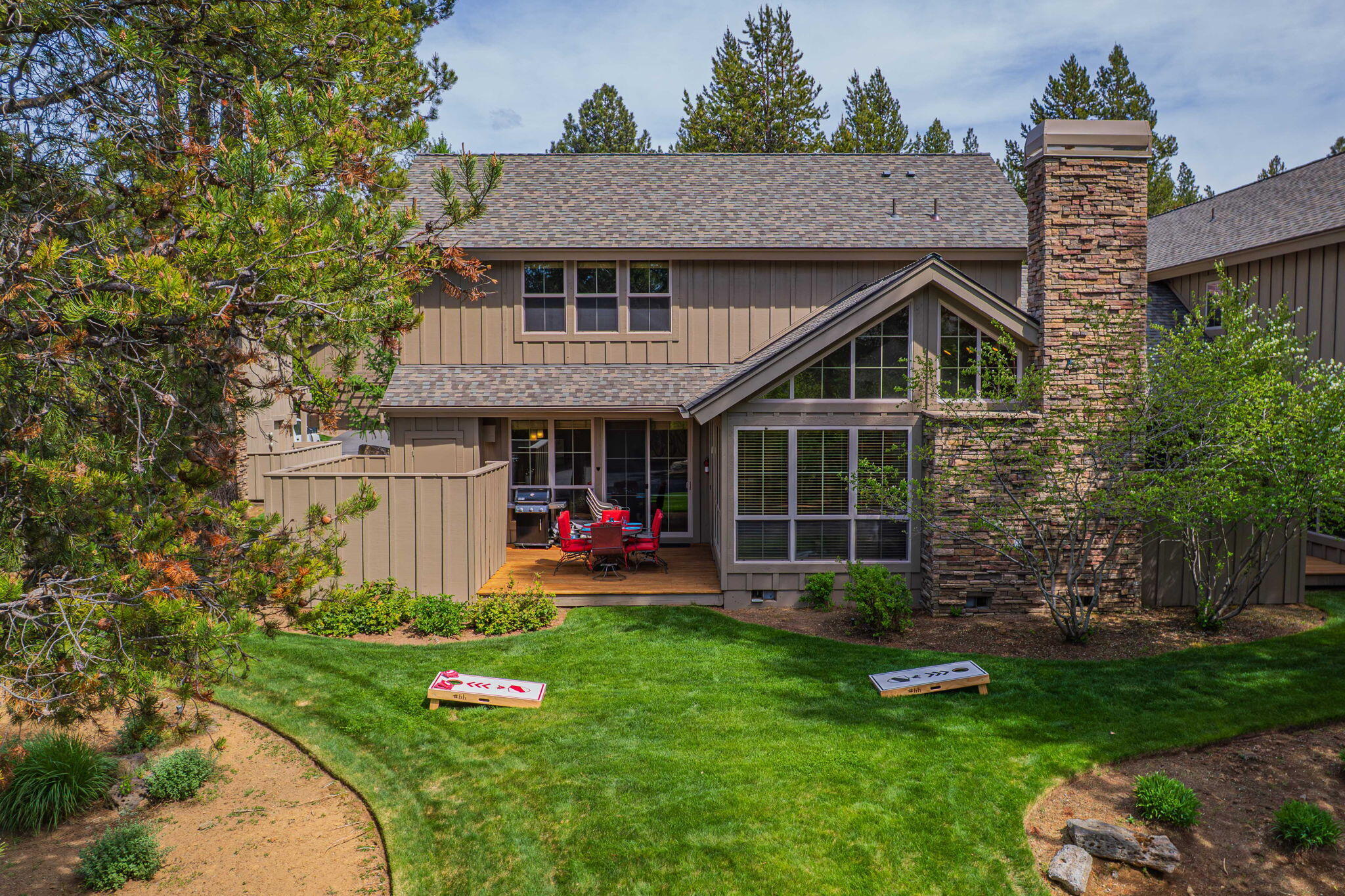 57129 Evergreen Loop, Unit 44 Sunriver, OR 97707 - Photo 50 of 59 a view of a house with backyard and porch