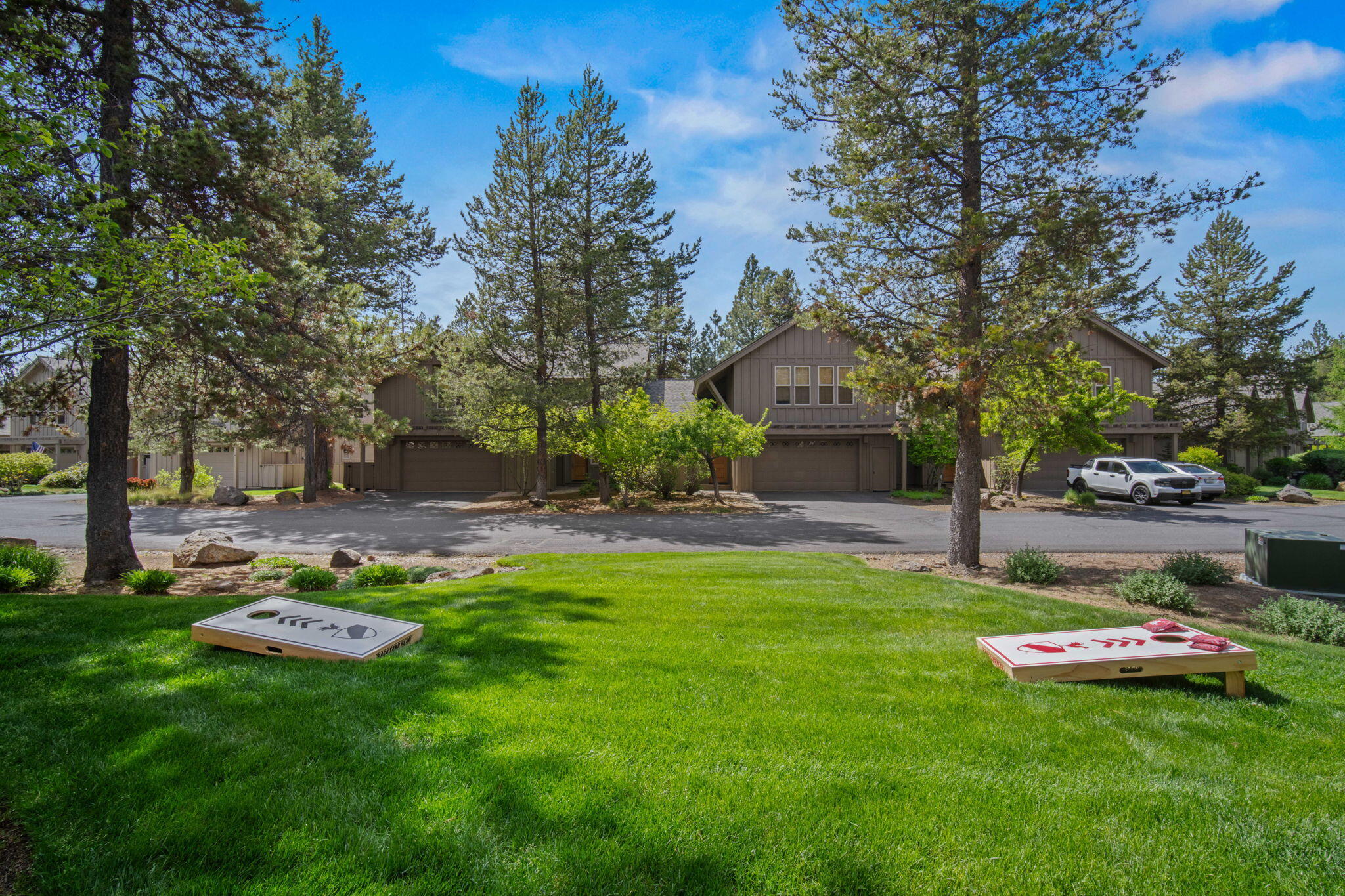57129 Evergreen Loop, Unit 44 Sunriver, OR 97707 - Photo 52 of 59 a view of a backyard with a garden