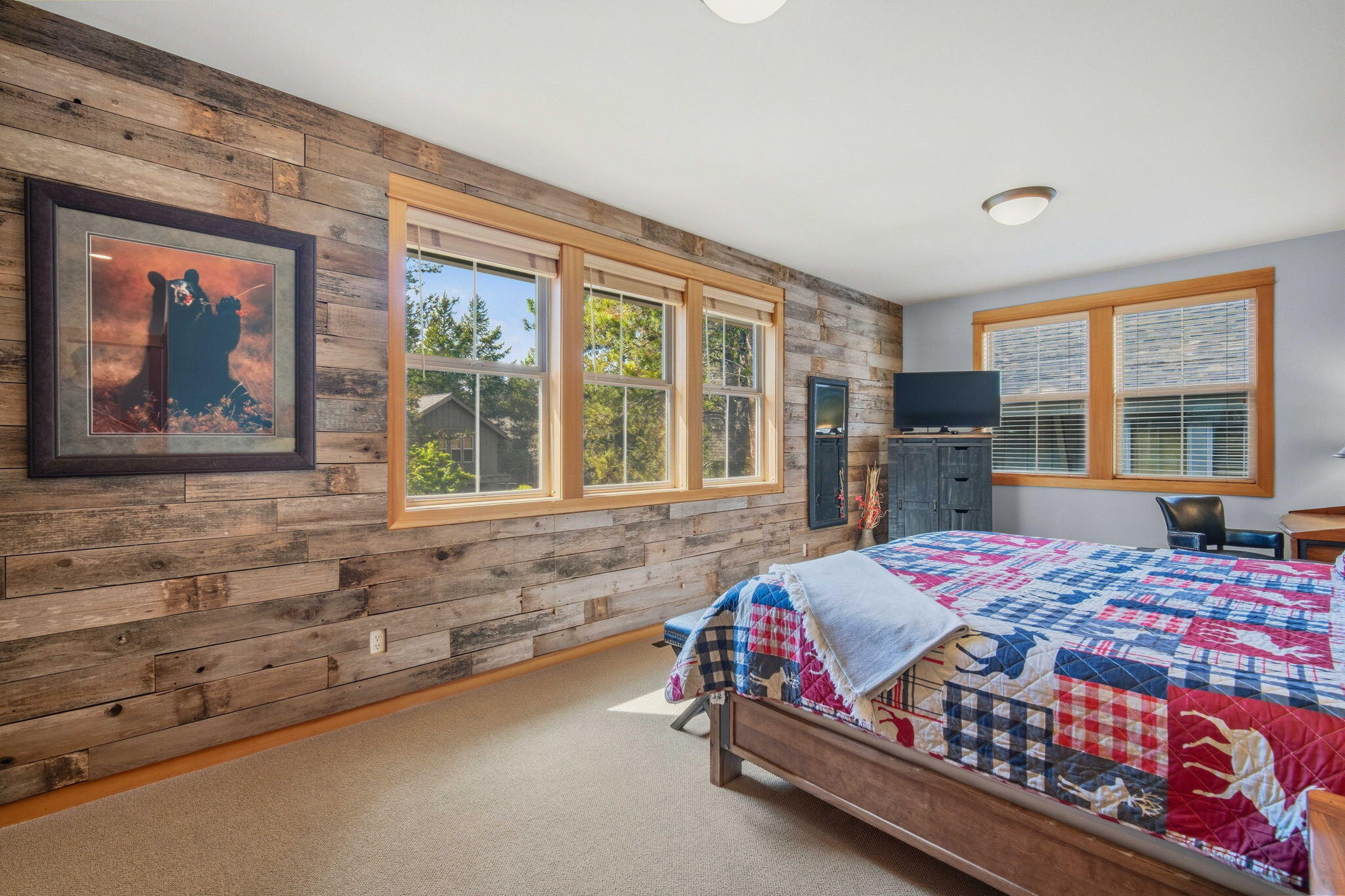 57129 Evergreen Loop, Unit 44 Sunriver, OR 97707 - Photo 9 of 59 a bedroom with a large bed and a large window