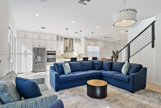 a living room with furniture and a rug