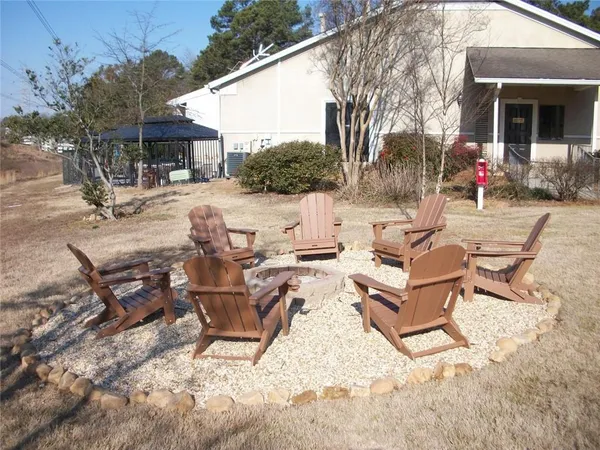 a view of a patio with a table and chairs