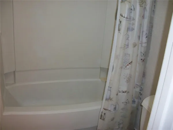a close up of a bathtub curtain
