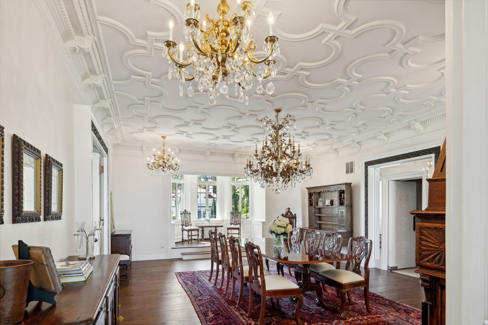 445 Sheridan Road Winnetka, IL 60093 - Photo 13 of 74 a view of a dining room with furniture a chandelier and wooden floor