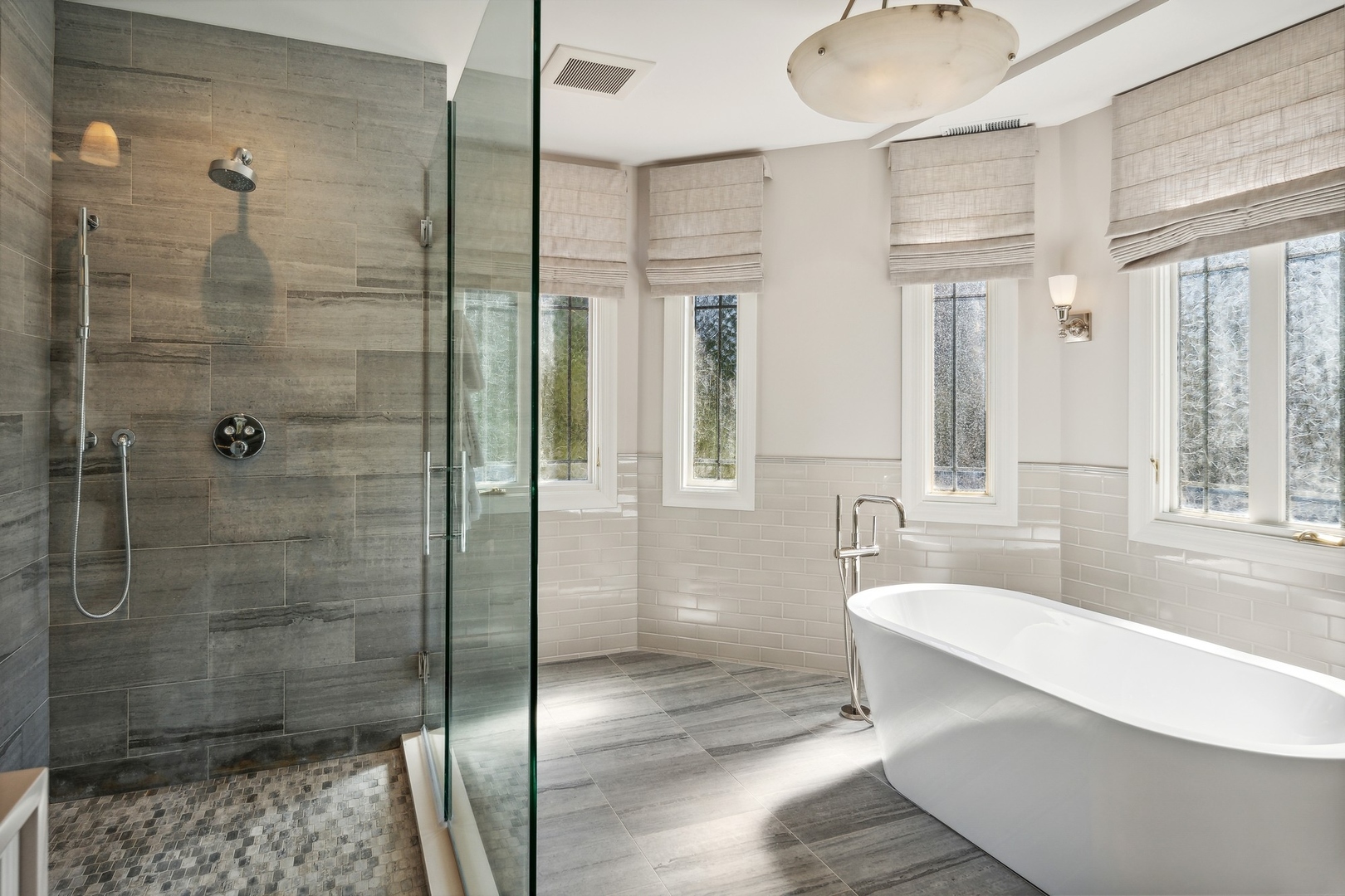 445 Sheridan Road Winnetka, IL 60093 - Photo 22 of 74 a bathroom with a bathtub and a shower