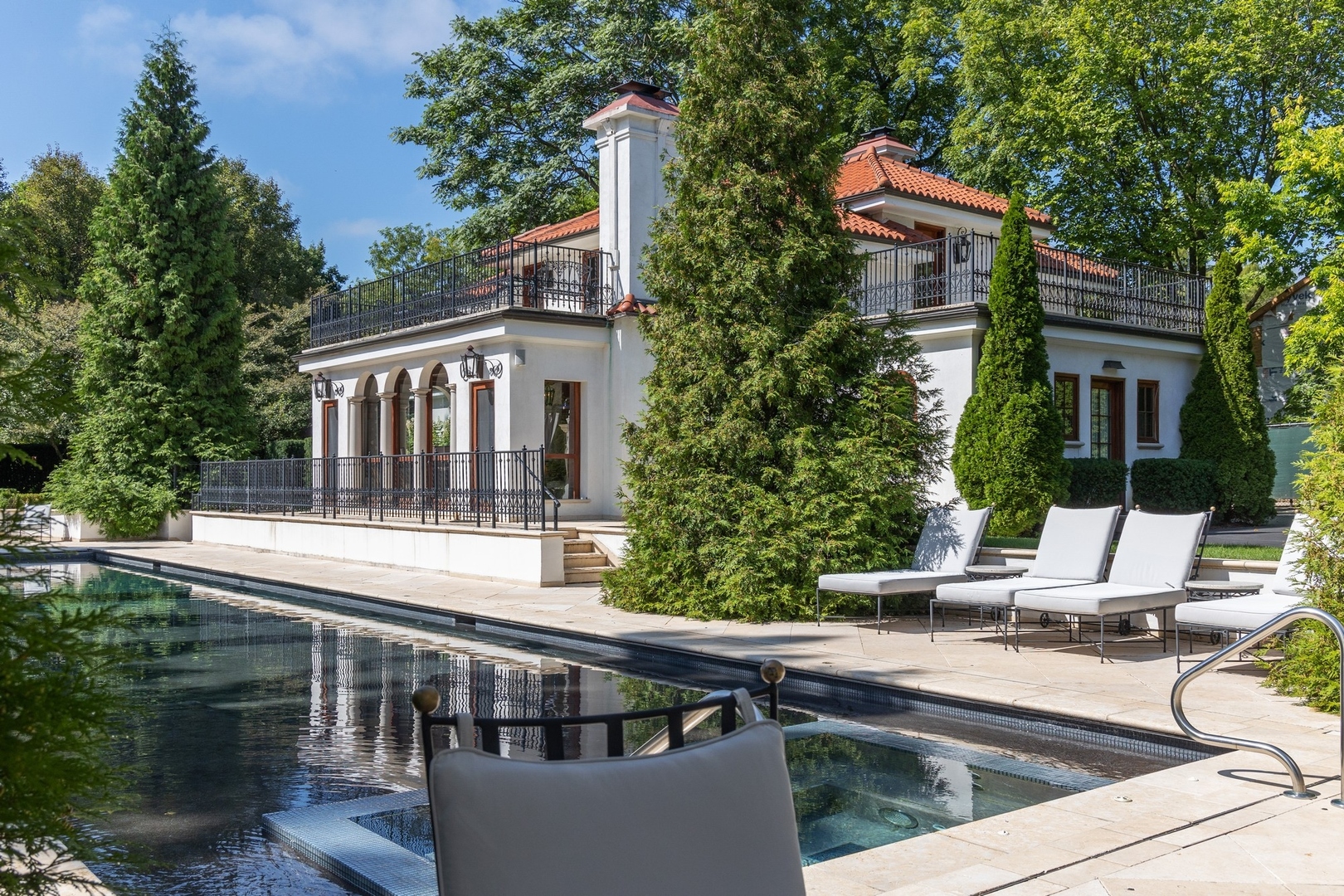 445 Sheridan Road Winnetka, IL 60093 - Photo 44 of 74 a view of a patio with couches table and chairs and potted plants