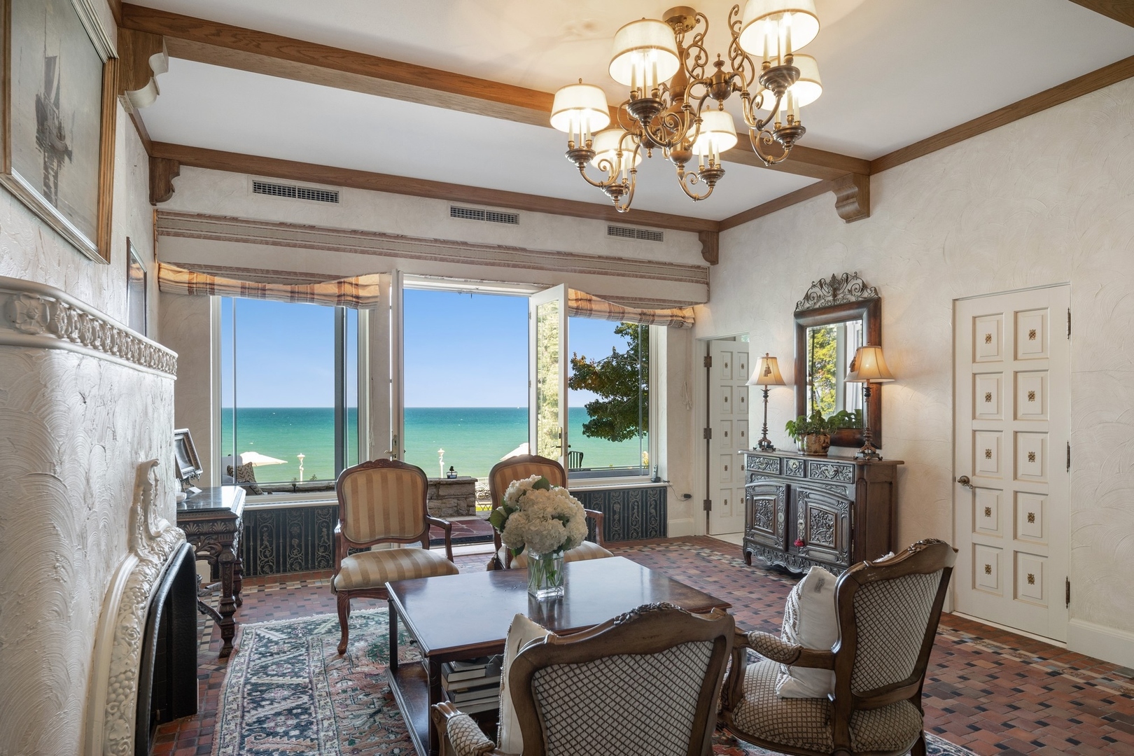 445 Sheridan Road Winnetka, IL 60093 - Photo 5 of 74 a living room with furniture a chandelier and a dining table
