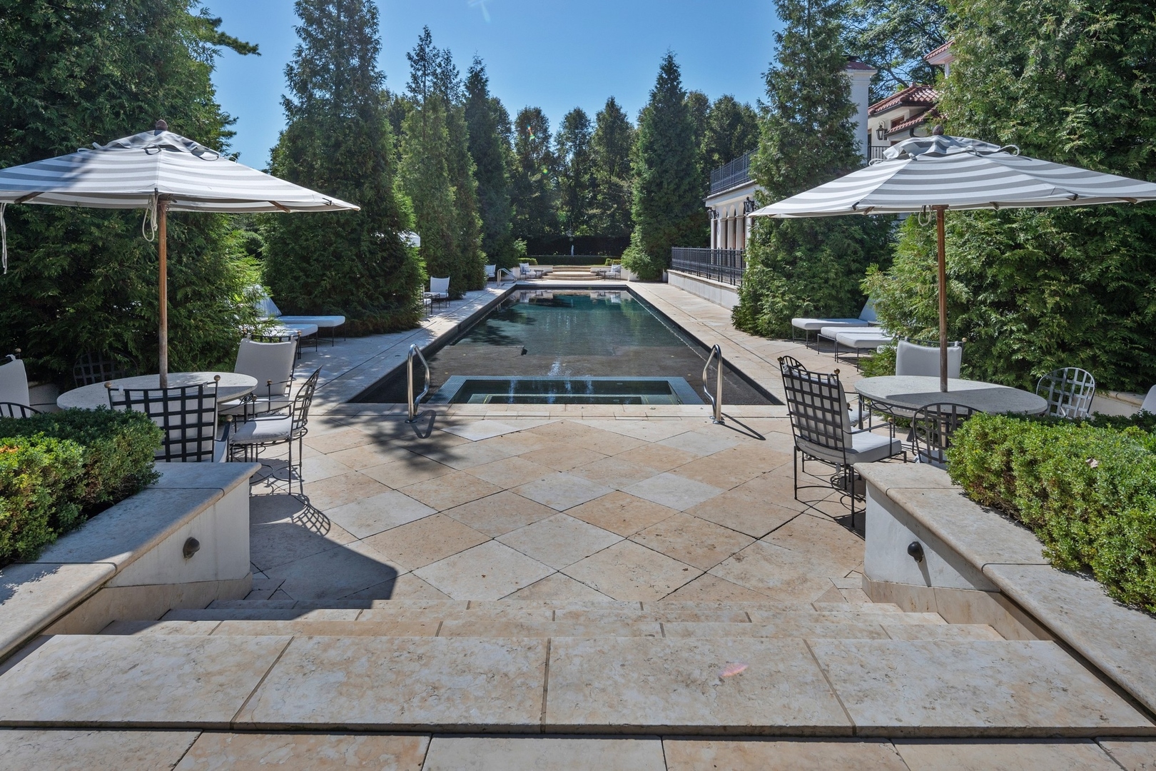 445 Sheridan Road Winnetka, IL 60093 - Photo 59 of 74 a view of a patio with table and chairs under an umbrella