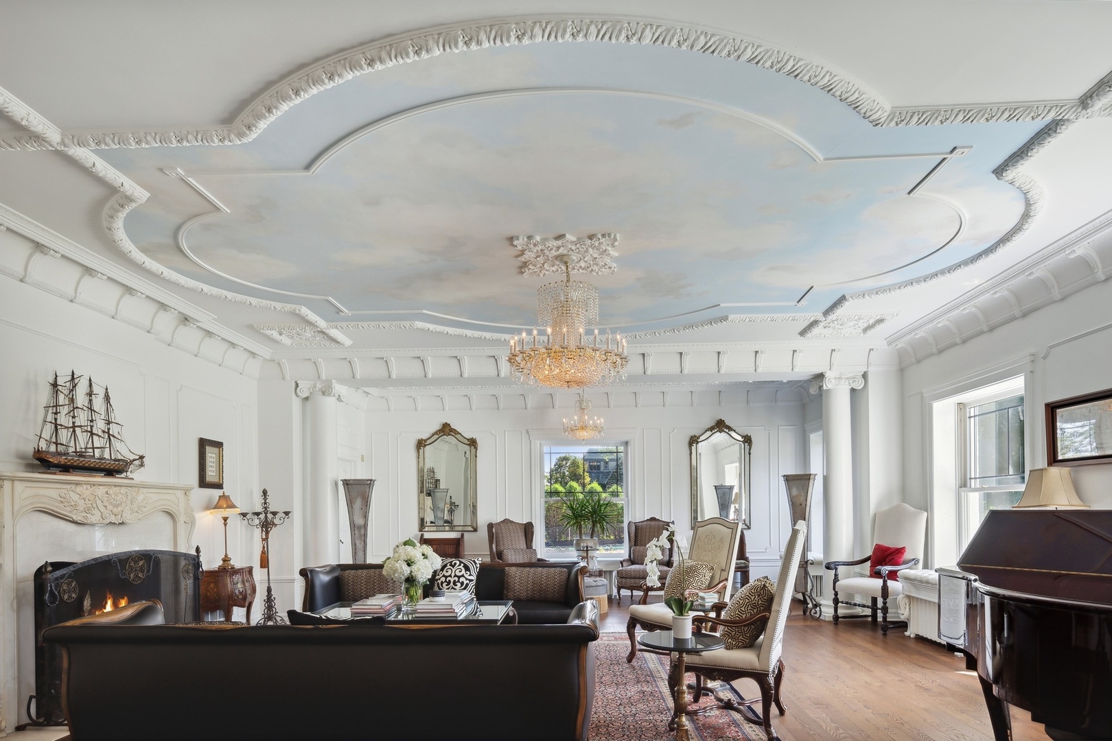 445 Sheridan Road Winnetka, IL 60093 - Photo 6 of 74 a living room with fireplace furniture and a chandelier