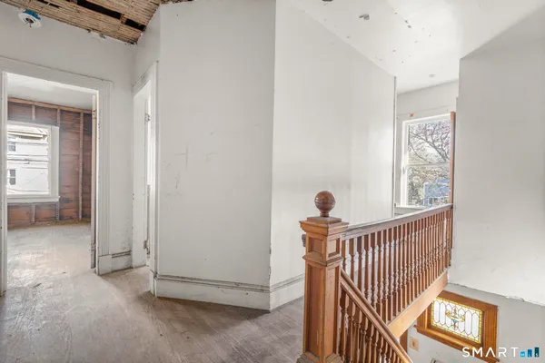 a view of a hallway with windows