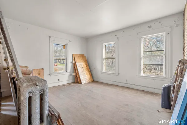 a view of a livingroom with furniture and a window