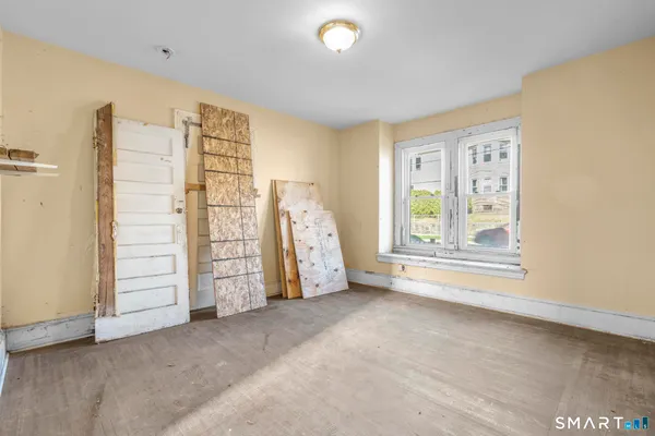 a view of an empty room with a window