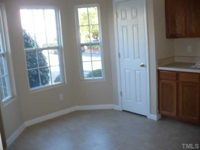 3406 Sosa Road Raleigh, NC 27610 - Photo 5 of 16 an empty room with windows