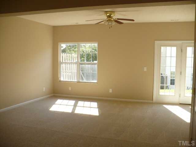 3406 Sosa Road Raleigh, NC 27610 - Photo 6 of 16 an empty room with windows