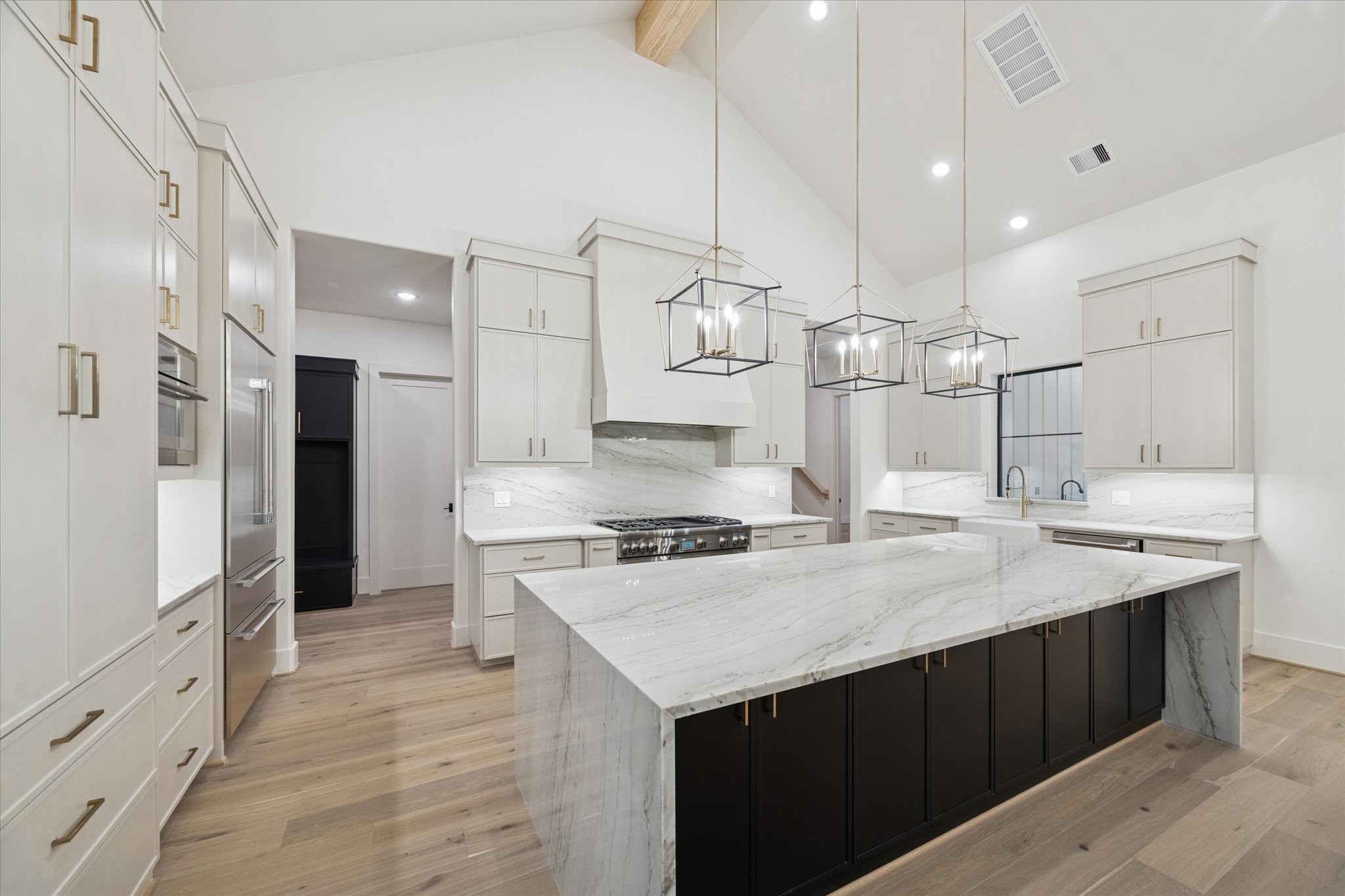 25179 Balmorhea Way Montgomery, TX 77316 - Photo 11 of 40 a kitchen with a sink stove and refrigerator