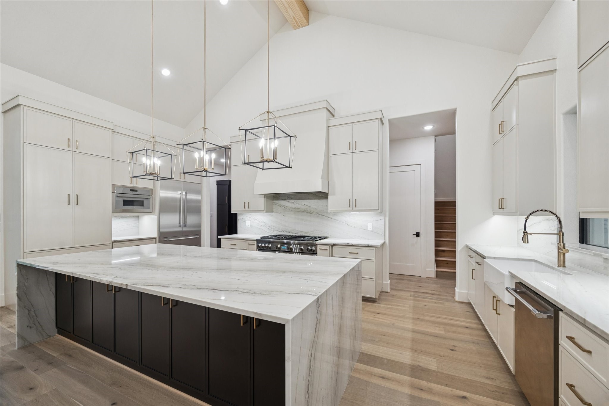 25179 Balmorhea Way Montgomery, TX 77316 - Photo 12 of 40 a kitchen with stainless steel appliances granite countertop a sink stove and refrigerator