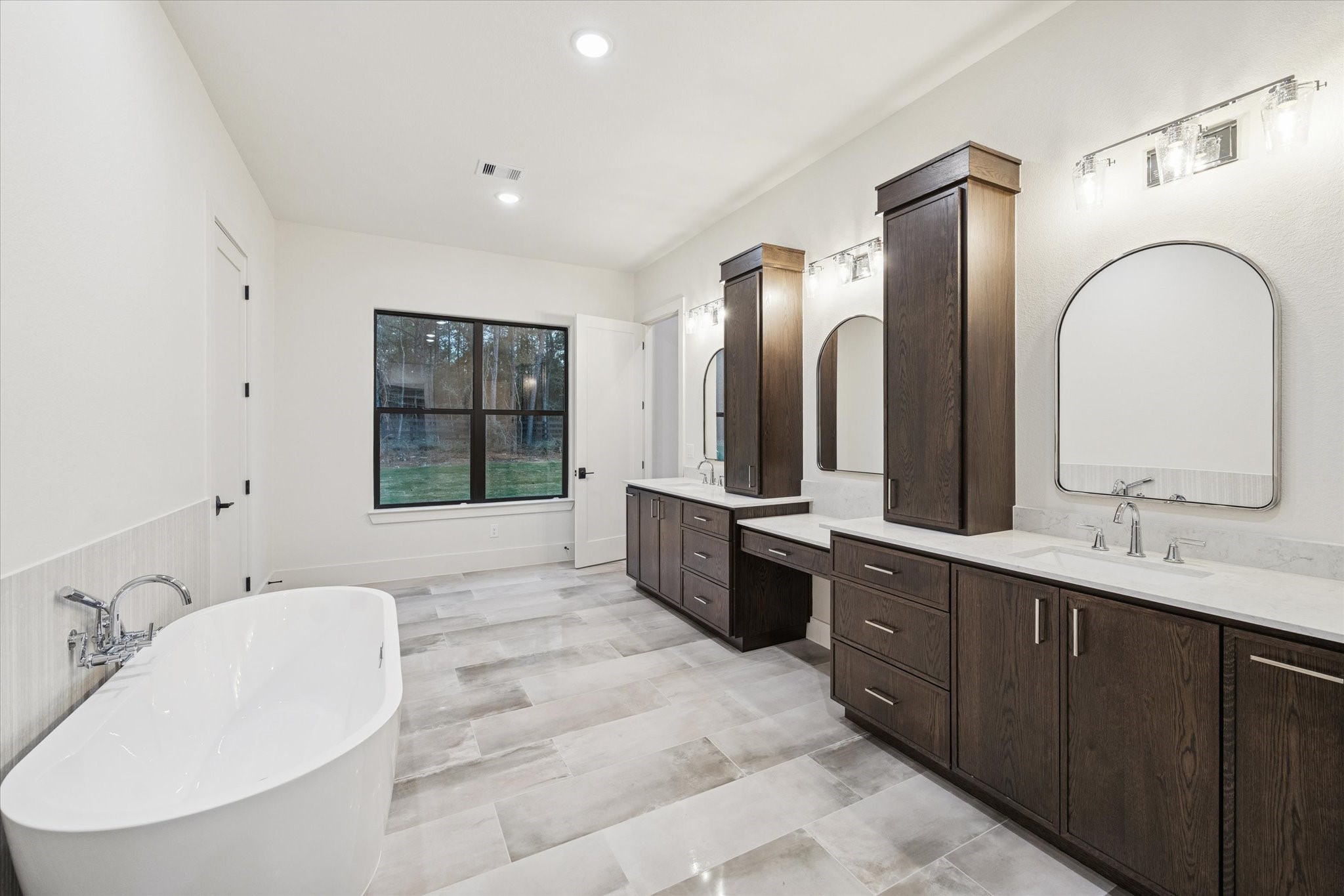 25179 Balmorhea Way Montgomery, TX 77316 - Photo 17 of 40 a spacious bathroom with a double vanity sink and a mirror