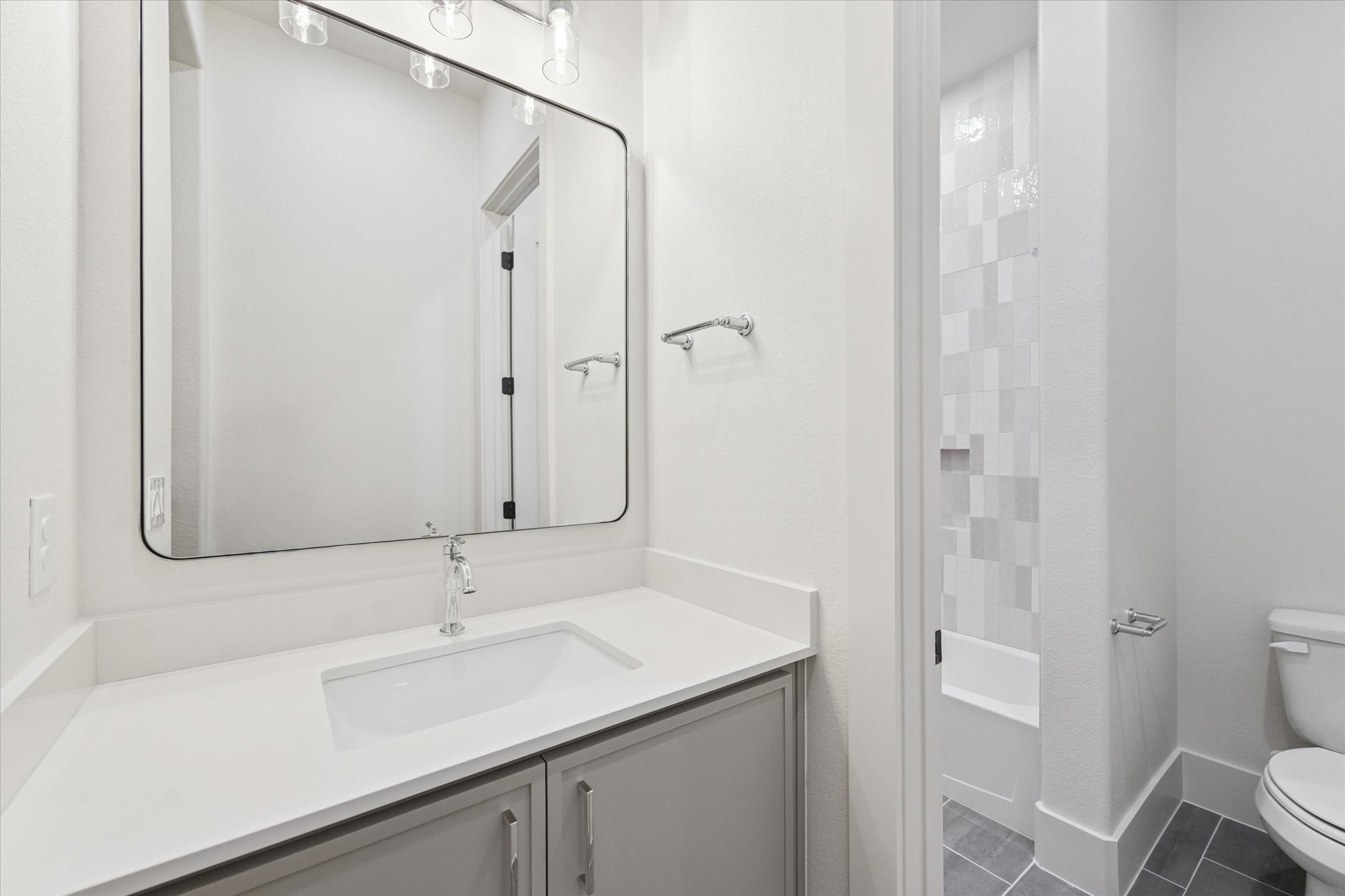 25179 Balmorhea Way Montgomery, TX 77316 - Photo 26 of 40 a bathroom with a sink a toilet and shower