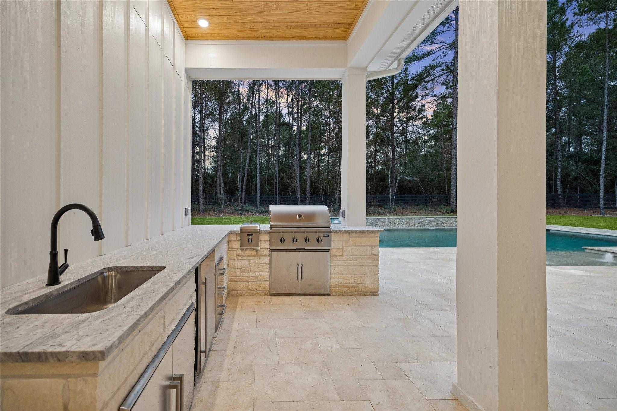 25179 Balmorhea Way Montgomery, TX 77316 - Photo 36 of 40 a kitchen with a sink and a stove top oven