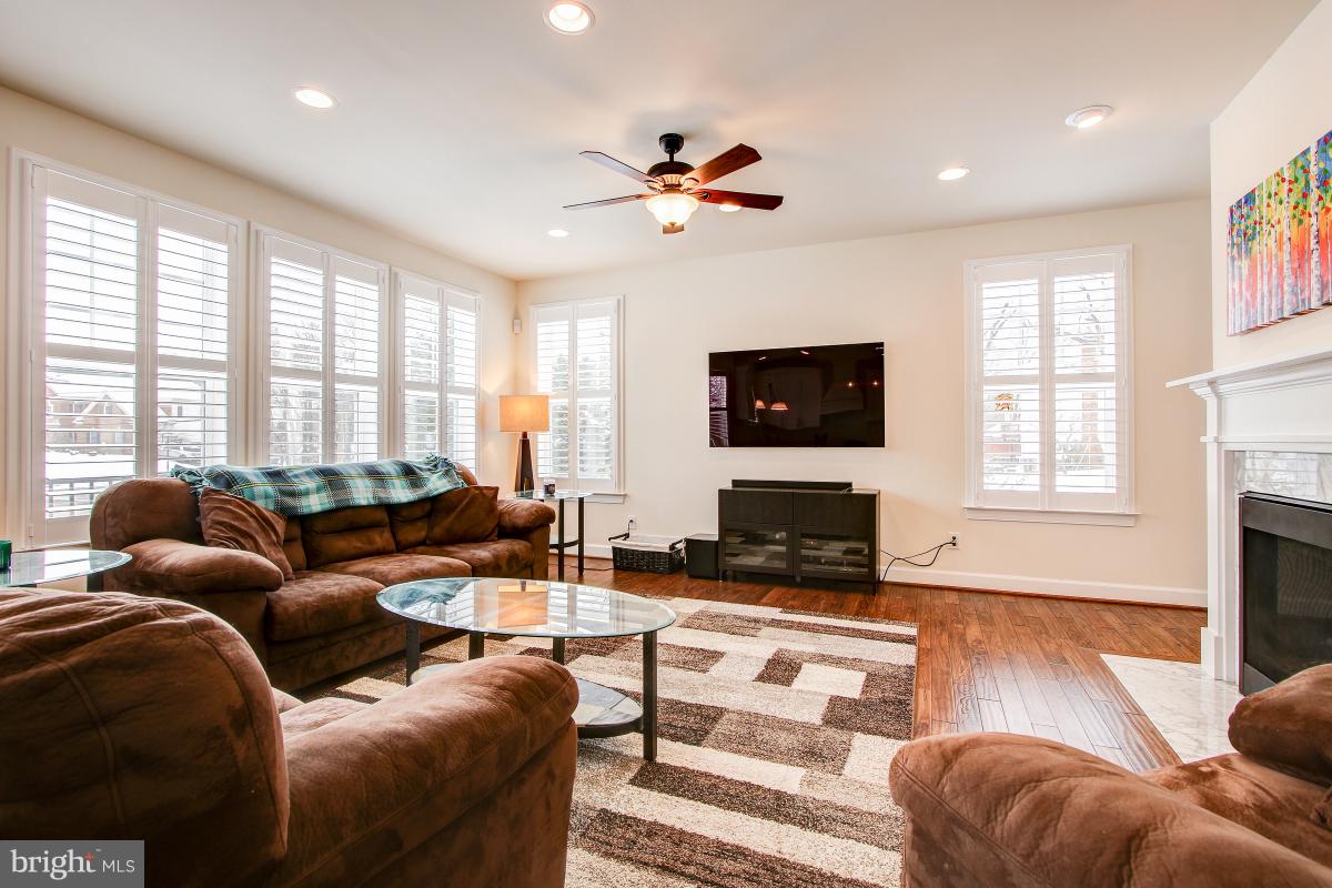 8391 Edward Carr Court Springfield, VA 22153 - Photo 13 of 67 Large open family room with gas fireplace