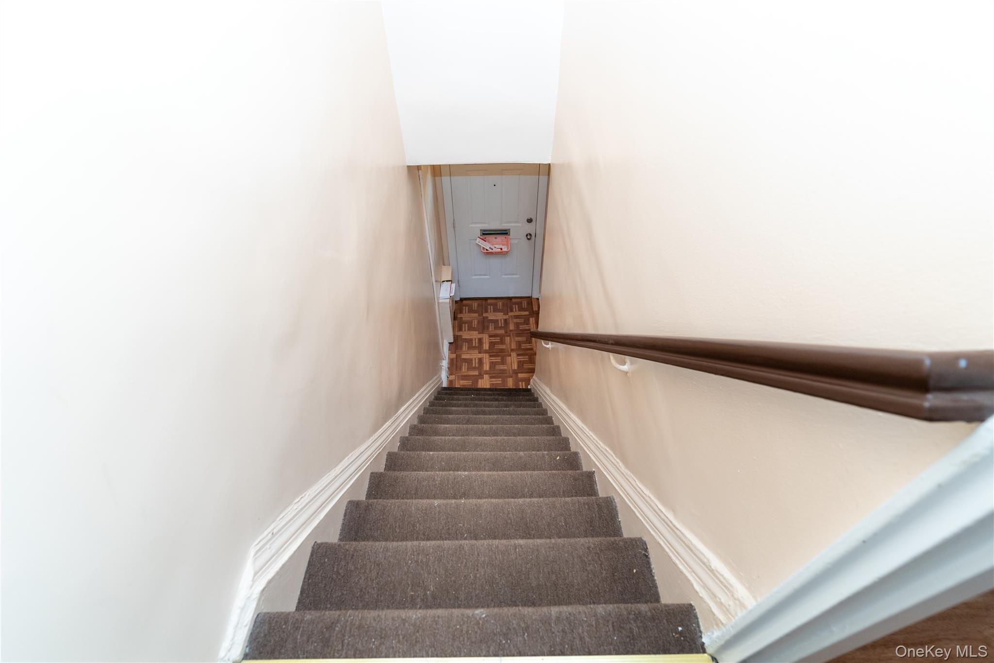 61-15 251st Street, Unit 1100 Queens, NY 11362 - Photo 15 of 17 Staircase to the 2nd floor entrance