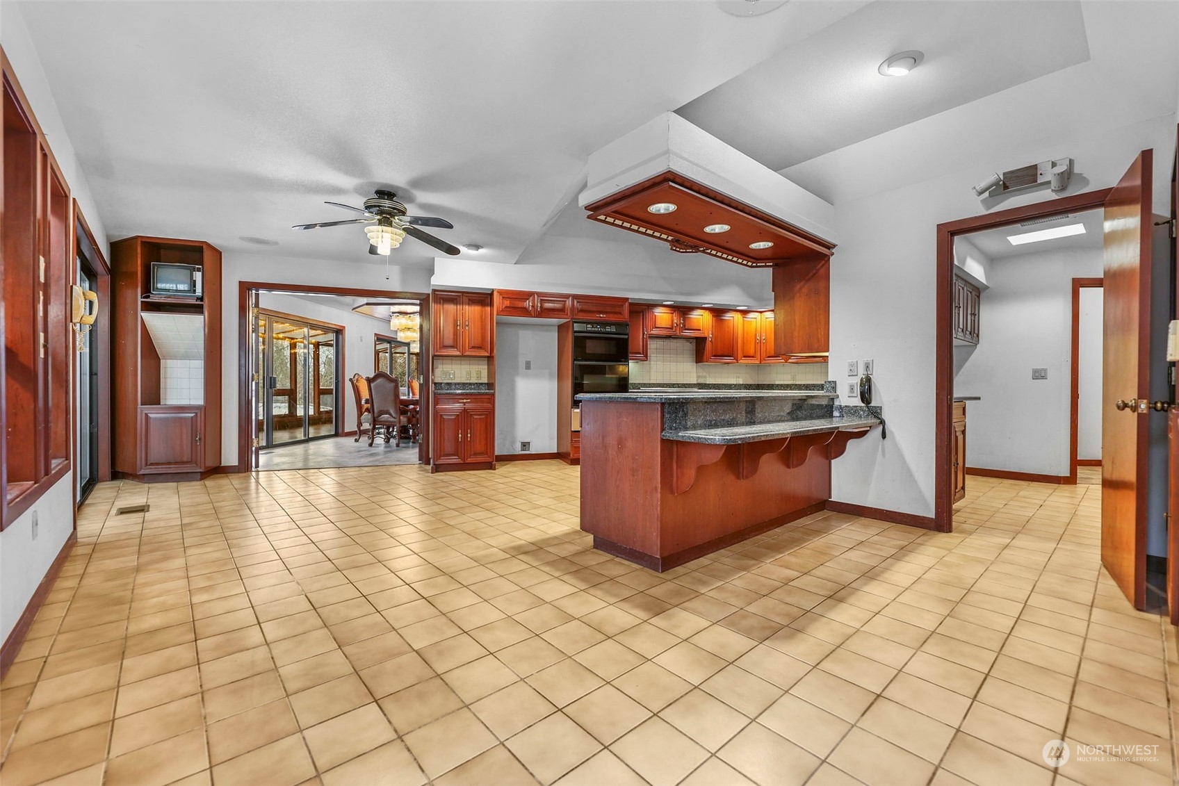 33600 132nd Street Southeast Sultan, WA 98294 - Photo 13 of 40 an empty room with wooden floor and chandelier