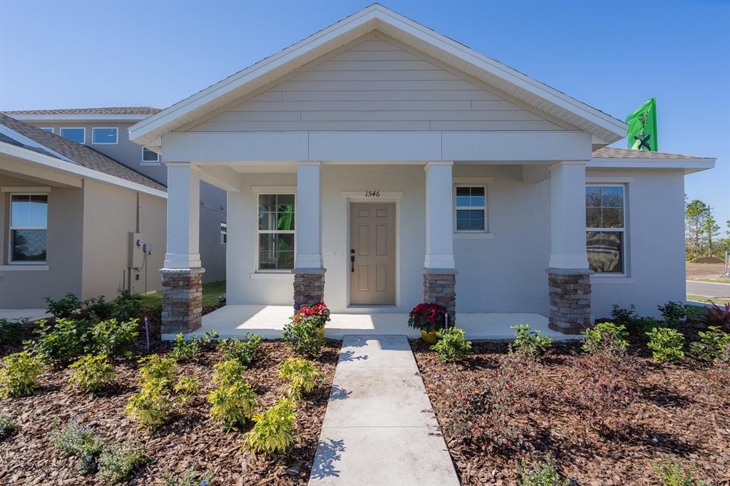 5662 Timber Meadow Way St. Cloud, FL 34771 - Photo 1 of 1 a front view of a house with garden
