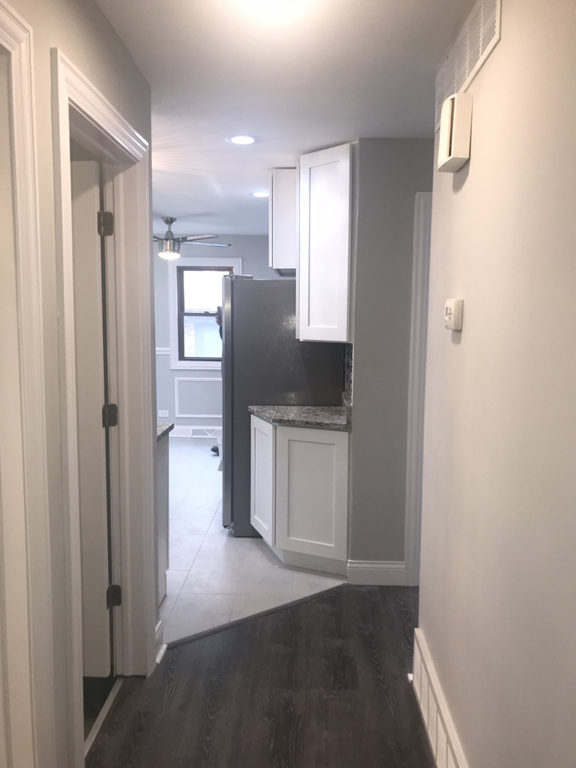 3710 147th Place Midlothian, IL 60445 - Photo 8 of 13 a kitchen with a refrigerator and white cabinets