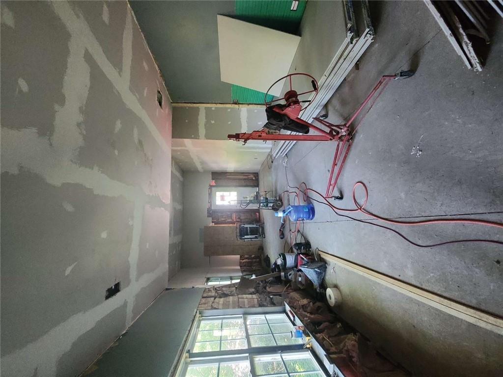 5 Ross Street Northeast Rome, GA 30161 - Photo 5 of 9 a room with gym equipment and a large window