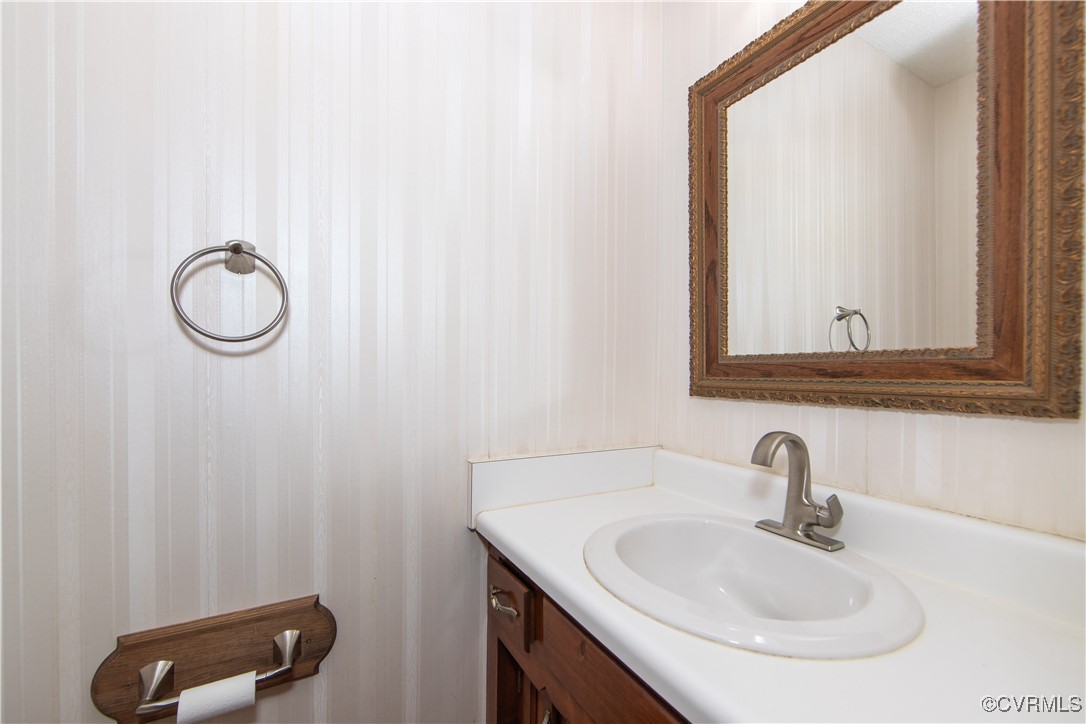 4728 Treely Road Chester, VA 23831 - Photo 20 of 38 a bathroom with a sink and a mirror
