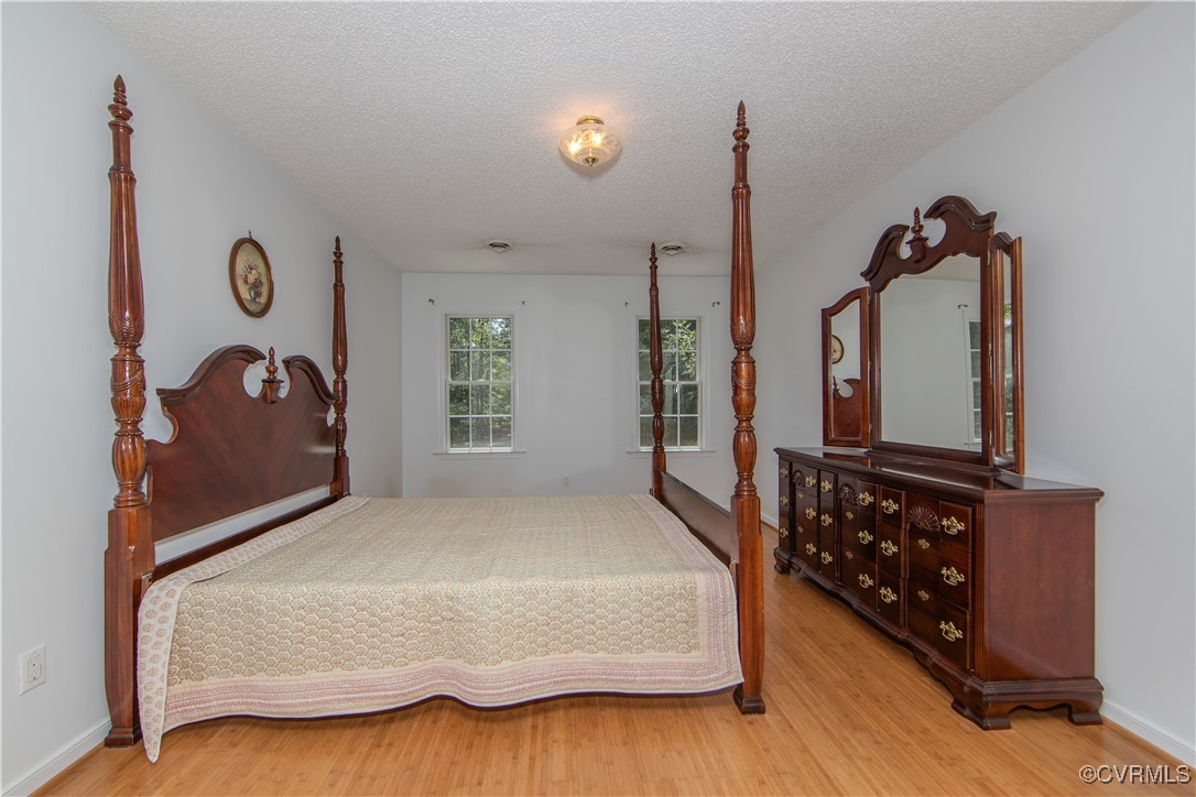 4728 Treely Road Chester, VA 23831 - Photo 31 of 38 a bedroom with a bed and a window