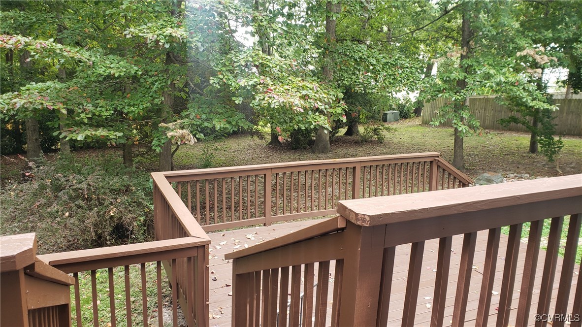 4728 Treely Road Chester, VA 23831 - Photo 8 of 38 a balcony with wooden floor and yard in back