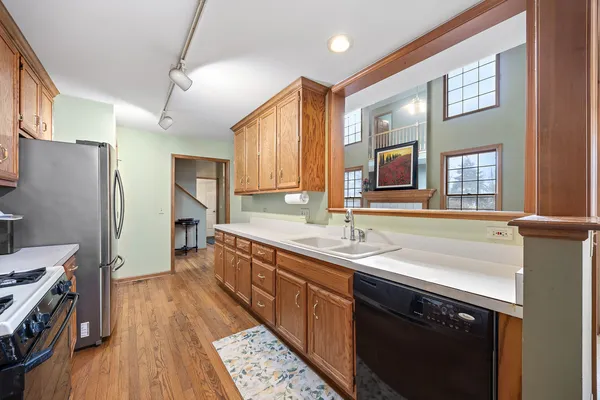 a kitchen with a sink stove and refrigerator