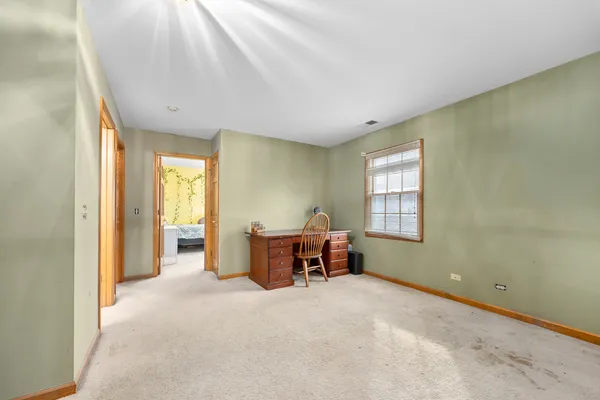 a view of a livingroom with furniture and windows