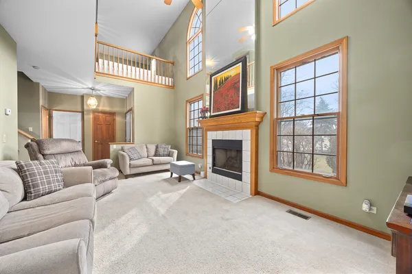 a living room with furniture and a fireplace