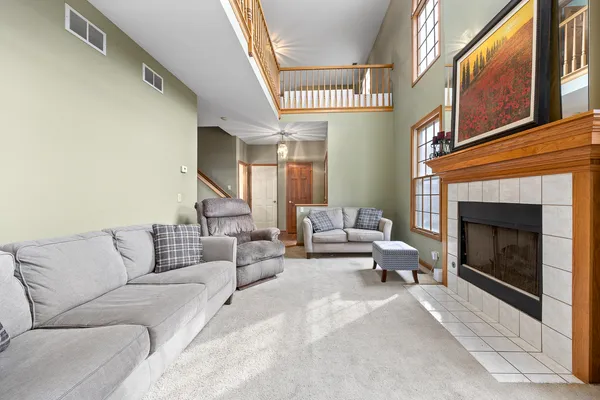 a living room with furniture and a fireplace