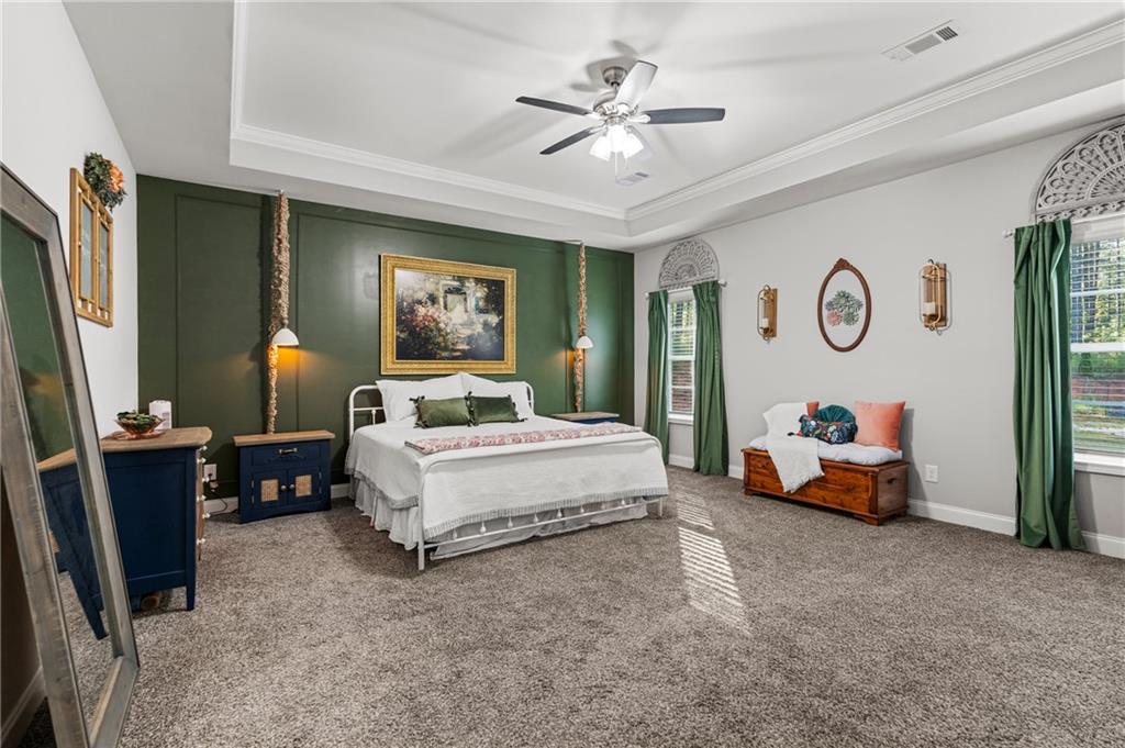3696 Lee Road Salem, AL 36874 - Photo 20 of 36 Expansive room featuring tray ceilings, a ceiling fan, and carpeted flooring
