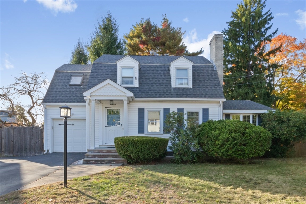 20 Village Road Newton, MA 02460 - Photo 1 of 27 a front view of a house with a garden