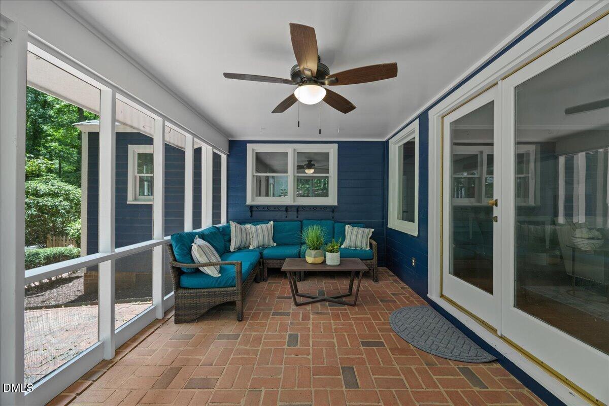6516 Bakersfield Drive Raleigh, NC 27606 - Photo 10 of 59 a living room with furniture and a large window