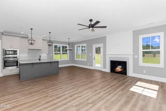 a view of kitchen with cabinets and wooden floor